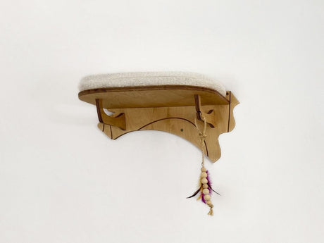 Wooden cat shelf with a decorative item on a white background