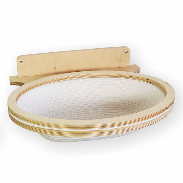 Woven cat basket with wooden handle on a white background