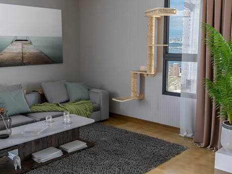 Modern living room with a gray sofa, coffee table, and cat wall tree.