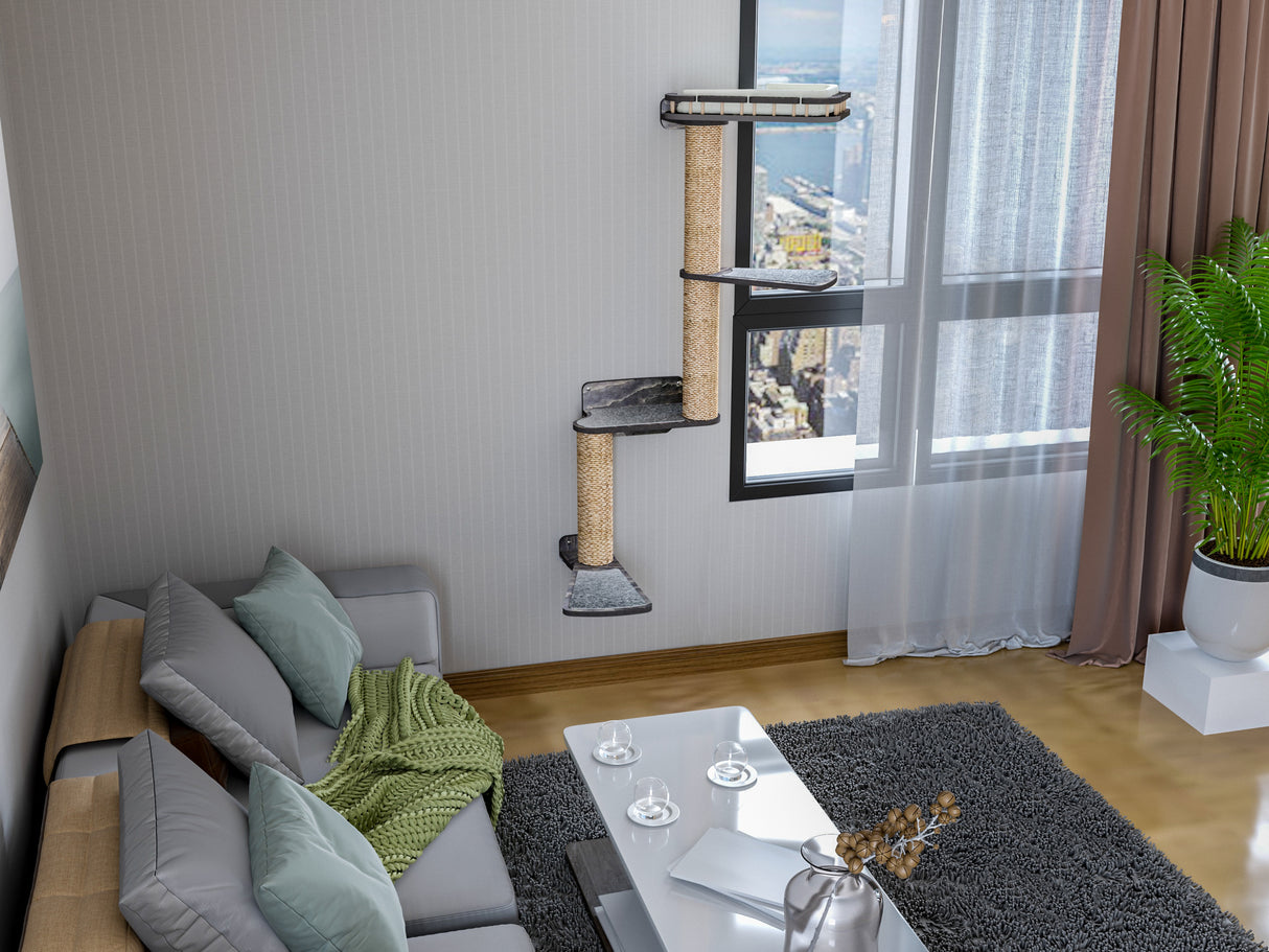 Living room with a cat tree, sofa, coffee table, and decorative items.