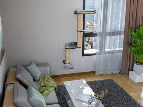 Living room with a cat tree, sofa, coffee table, and decorative items.