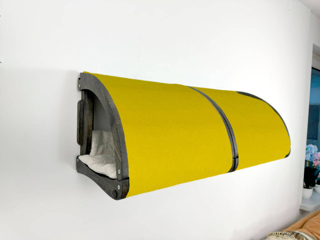 Yellow pet bed attached to a white wall