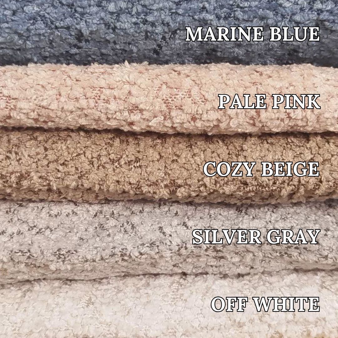 Stack of textured fabric swatches labeled with color names and descriptions.