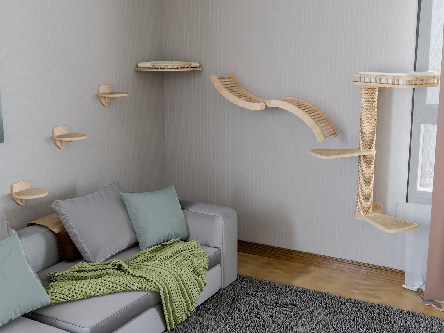 Cat climbing shelves on a wall above a sofa with green blanket