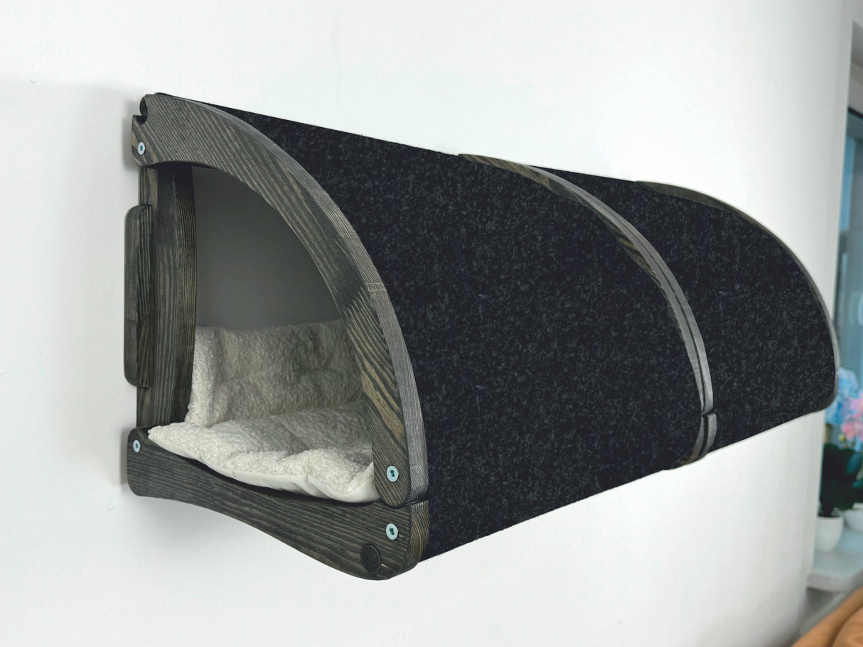 Wall-mounted pet bed with cushion on a white background