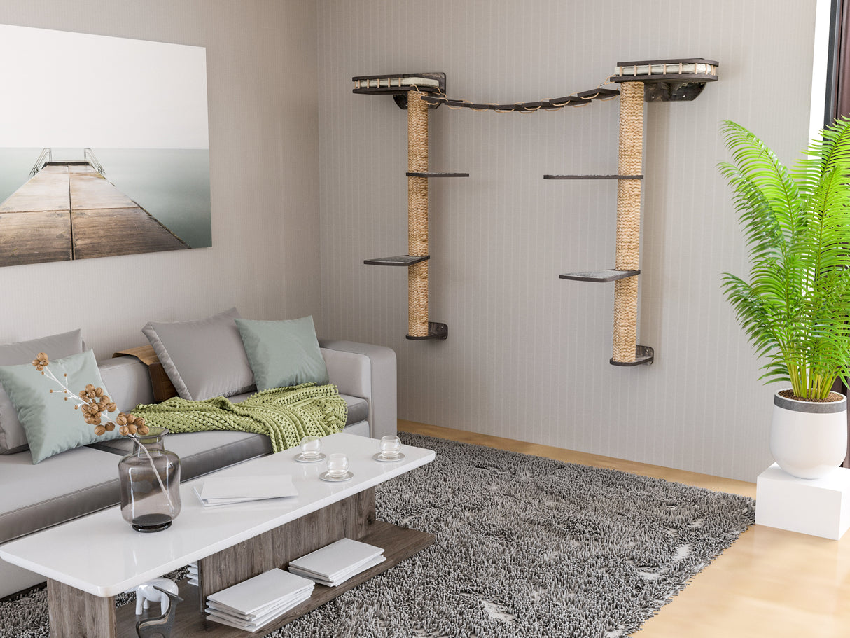 Living room with gray sofa, coffee table, and wall-mounted cat tree.