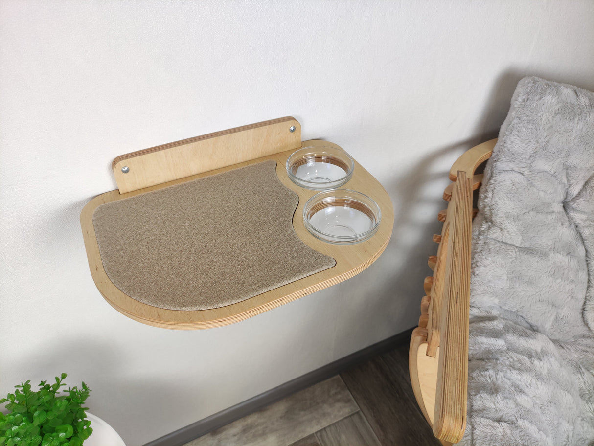 Elevated cat feeding shelf made of light plywood, featuring two right-positioned glass bowls.