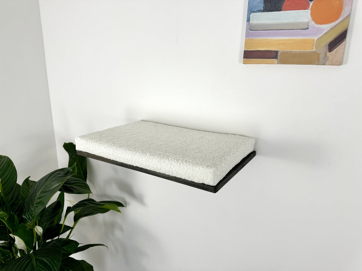 soft cushion on the cat shelf