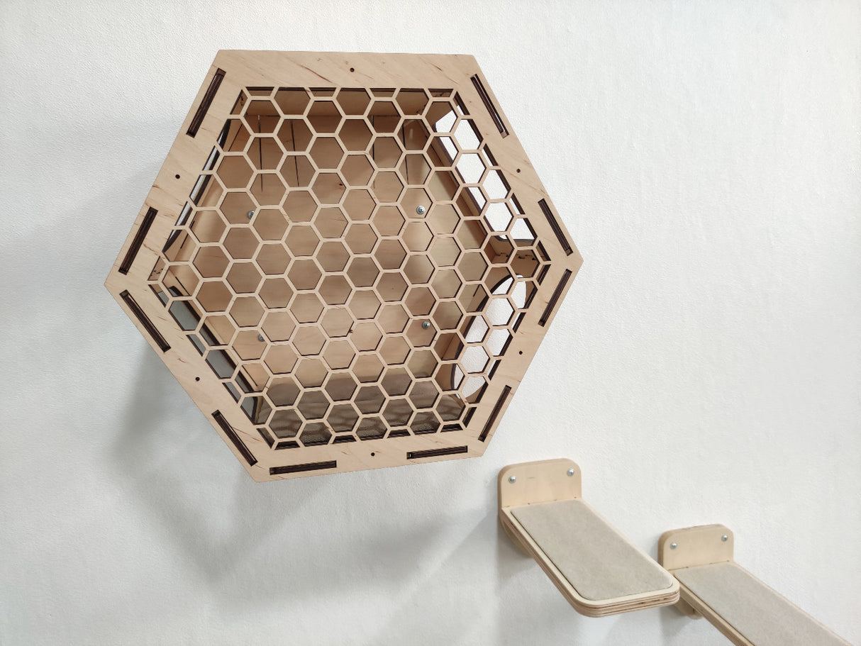 Set of hexagonal wall mounted cat perches in light wood color. 3 shelves and 3 steps for cat comfort.