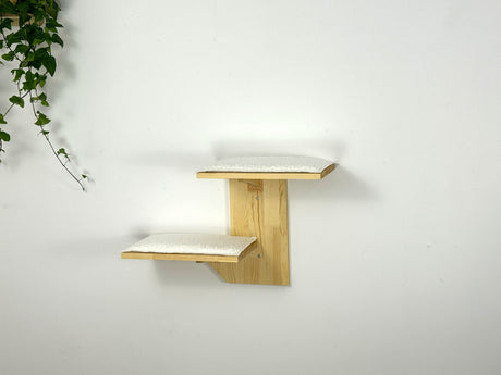 two-level cat shelves on the wall