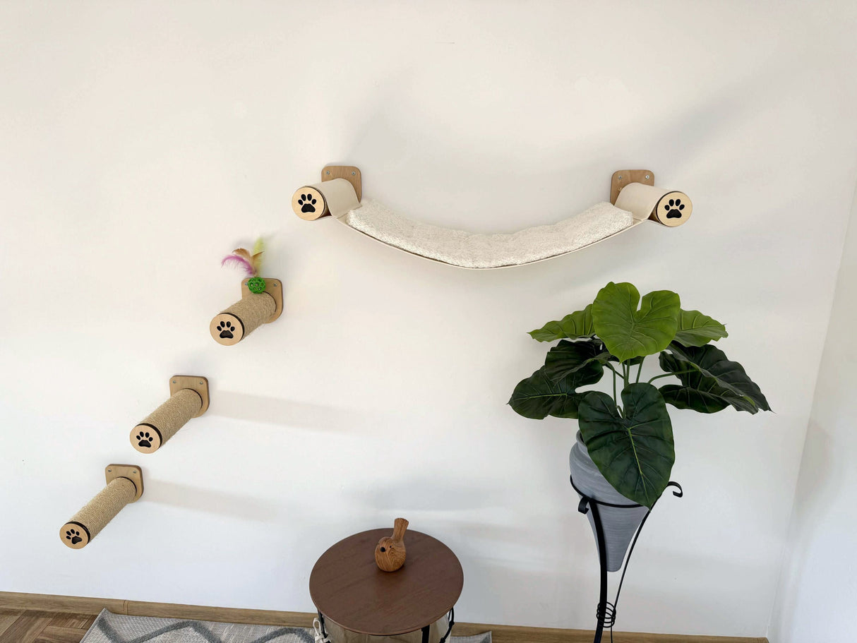Cat climbing shelf attached to a wall with a plant below