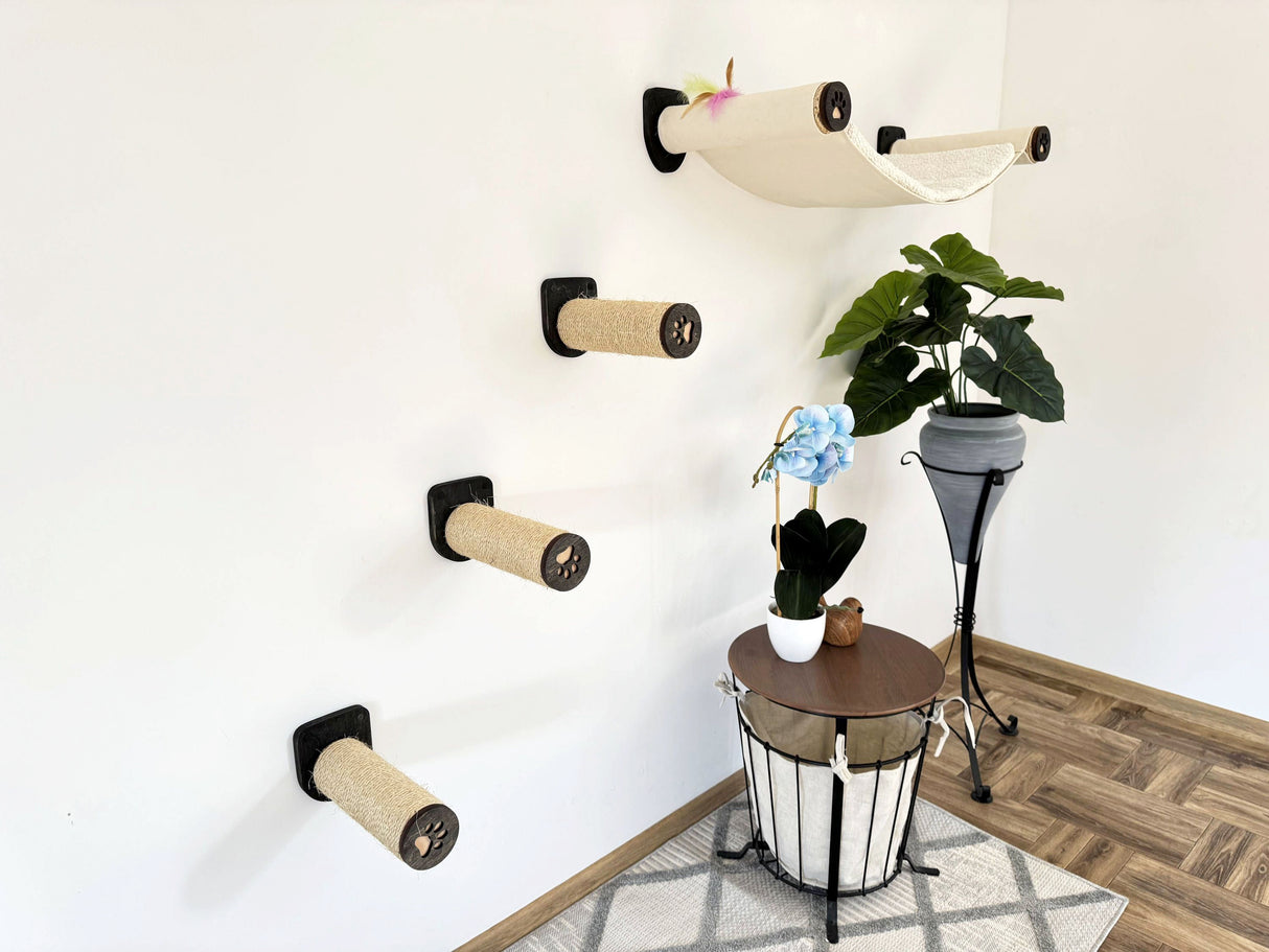 Cat climbing wall with various levels and a plant on a stand in a room.