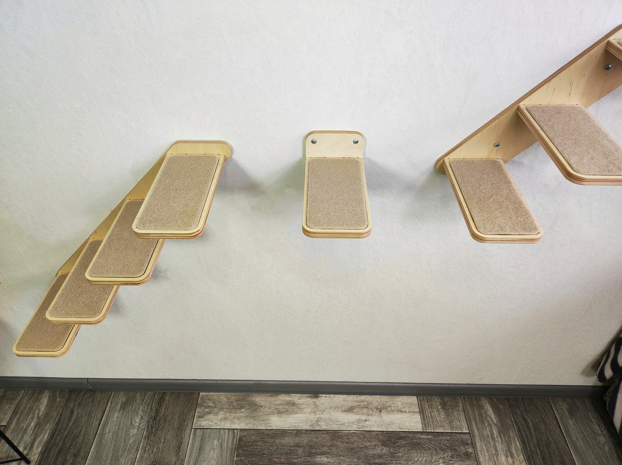 Space-saving cat wall step set with natural wood and carpeted surfaces for secure climbing.