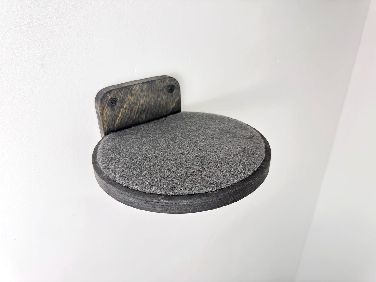 Elevated cat step in a dark wood finish, round design with non-slip carpet for safe climbing