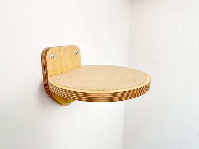 Round wall-mounted cat step with secure carpet, natural wood finish. Perfect for climbing and lounging