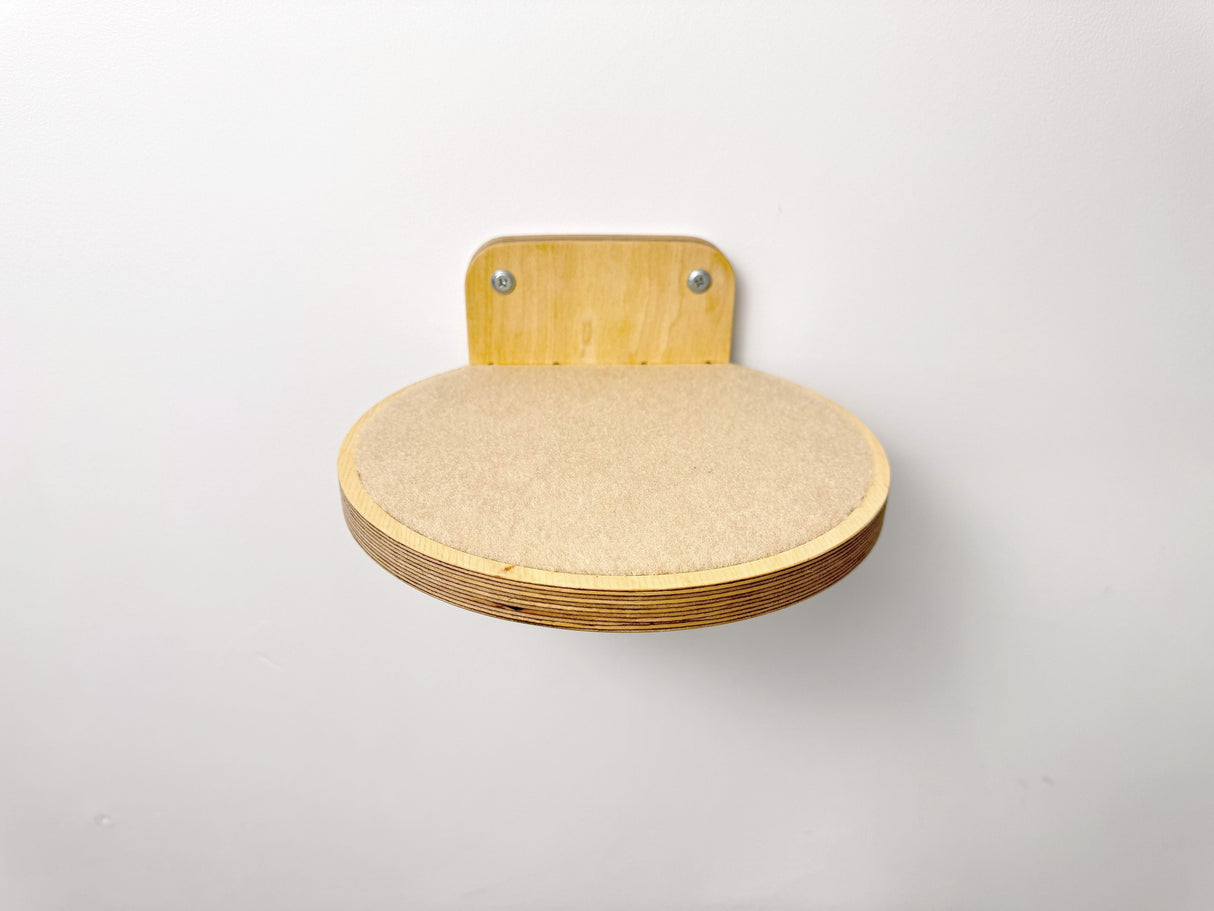 Durable round cat wall perch with soft carpet, offering a cozy resting or climbing spot for your pet