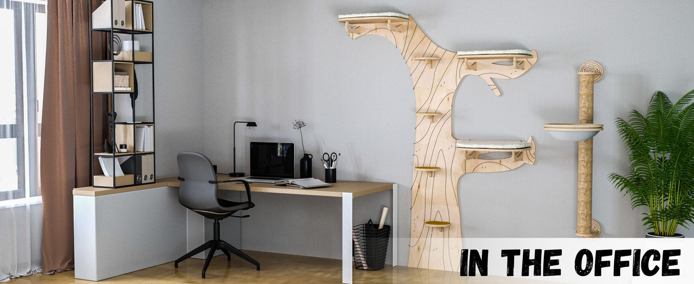 Modern office setup with a desk, chair, and cat wall tree.