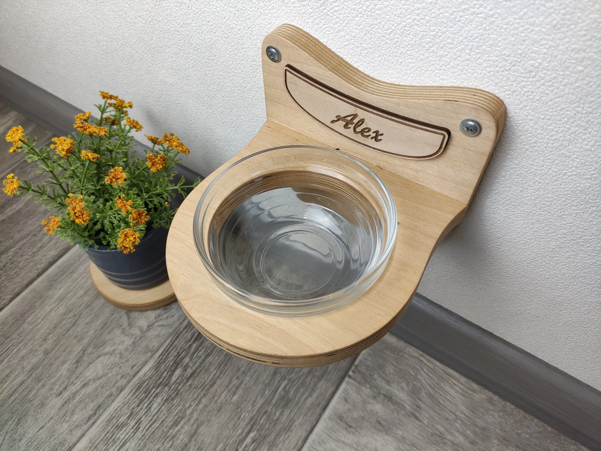 Minimalist cat feeder in light birch wood with elevated glass bowl