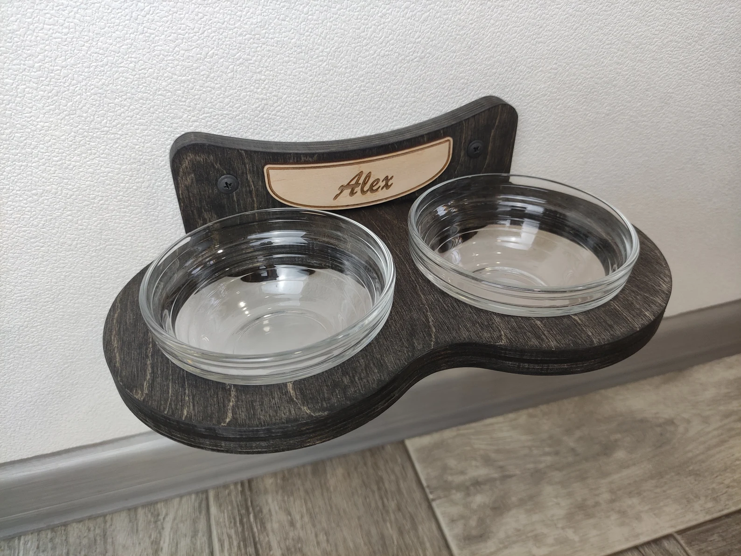 Modern wall-mounted cat shelf feeder in dark wood finish
