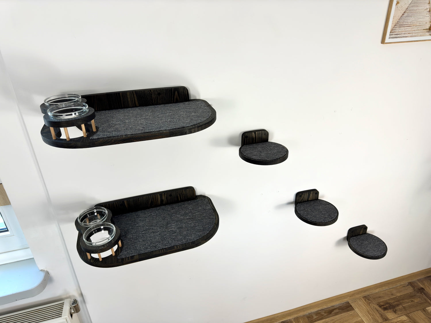 two cat wall shelves with bowls and steps