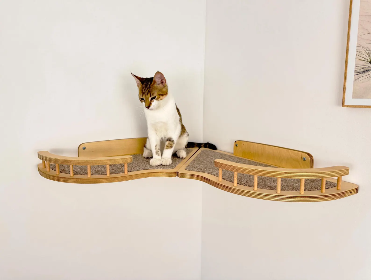 Set of wall shelves for a cat in the corner of the room