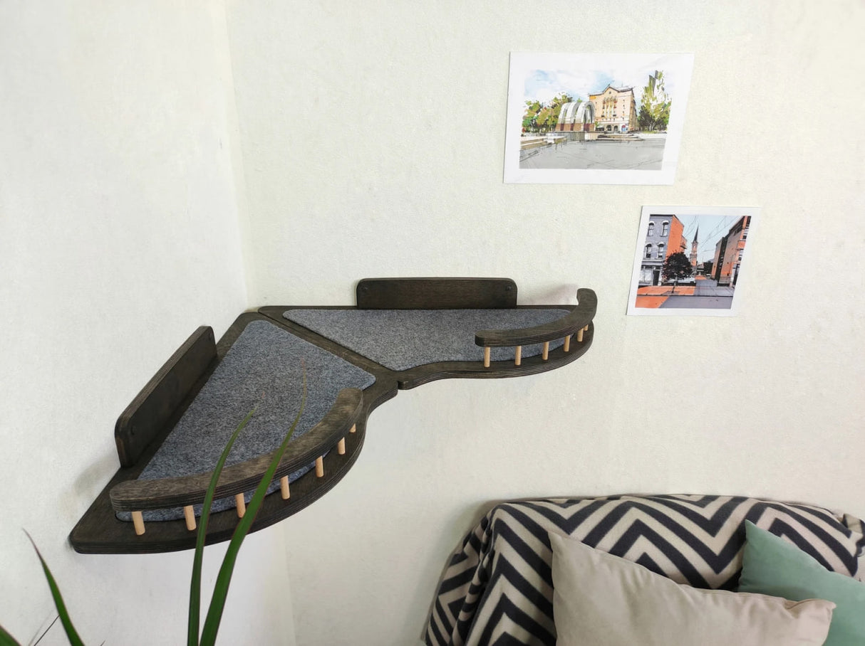 Set of wall shelves for a cat in the corner of the room