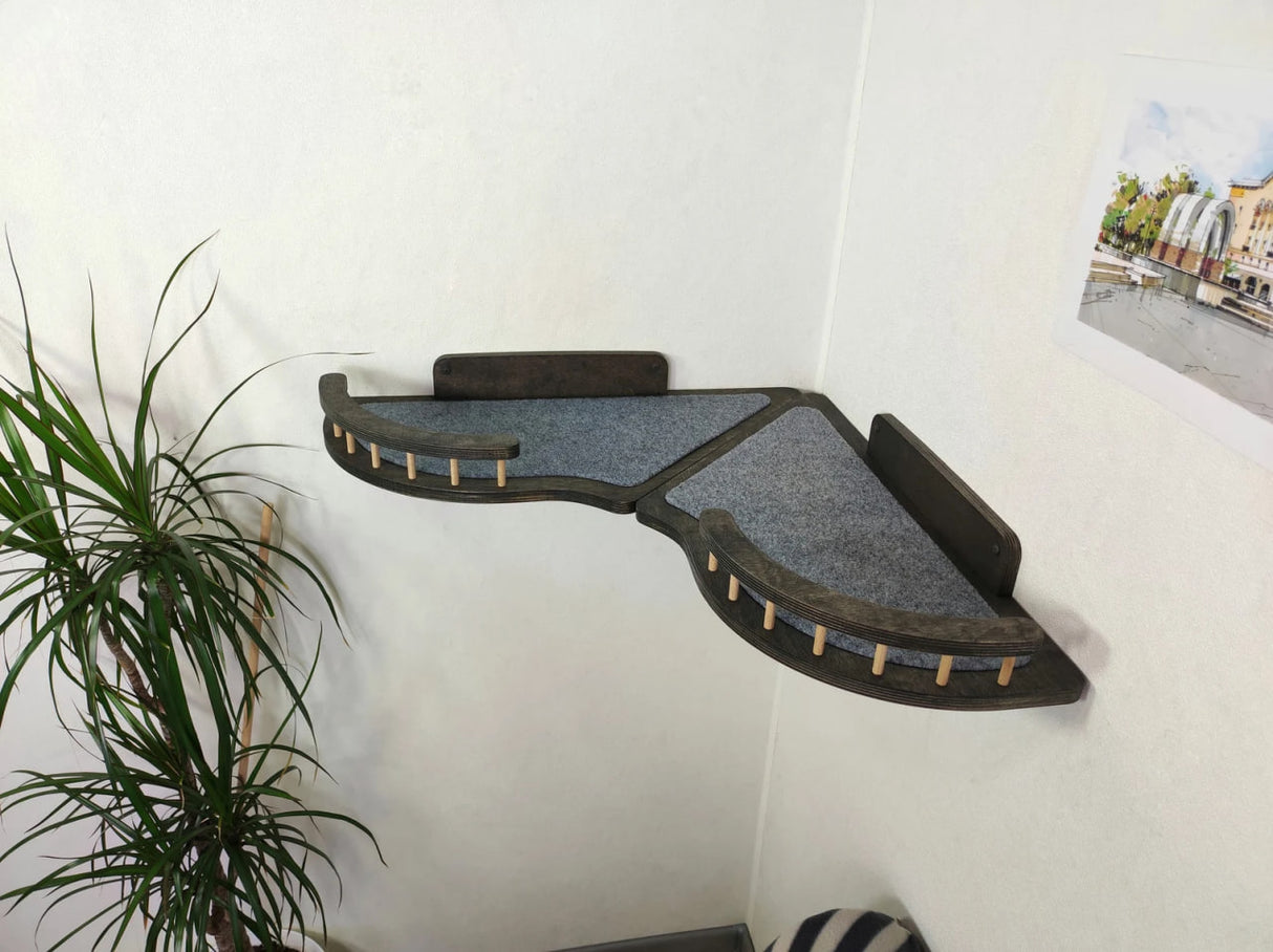 Set of wall shelves for a cat in the corner of the room