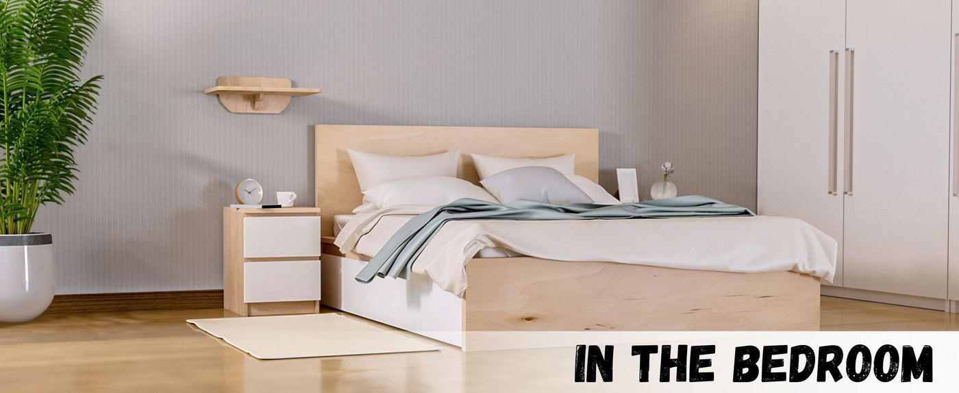 Modern bedroom with wooden bed, nightstands, and cat wall shelf.