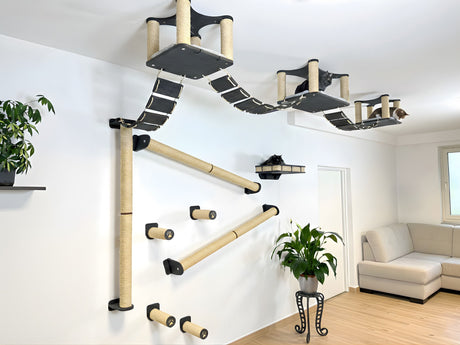 Wooden climbing furniture for cats on a white wall in a living room.