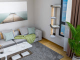 Modern living room with a gray sectional sofa, coffee table, and cat tree.