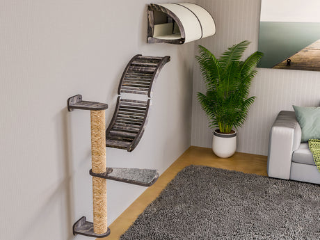 Cat climbing tower with shelves in a living room setting