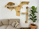 Cat on a wooden cat tree with shelves and a scratching post next to a beige sofa and potted plant.