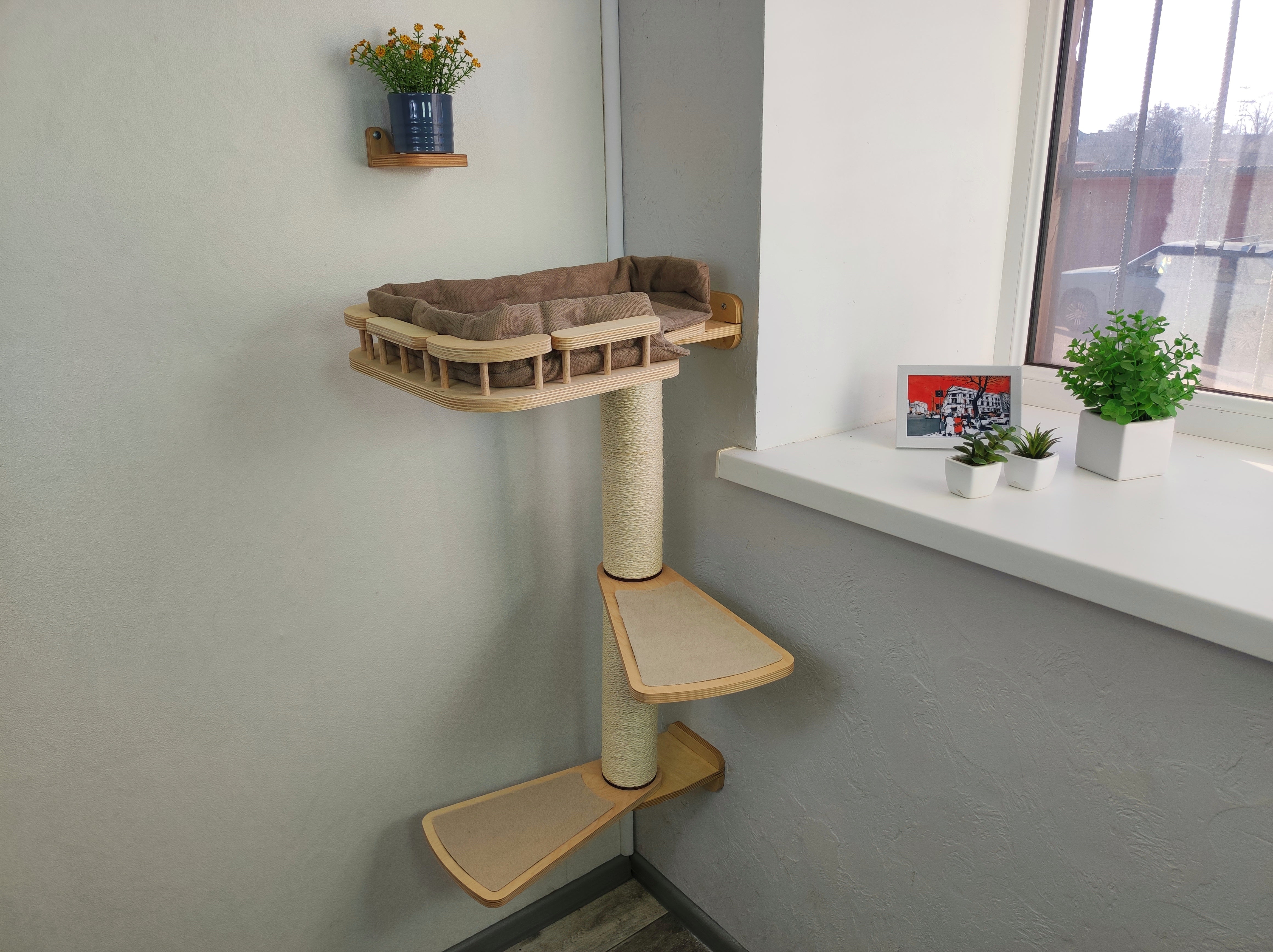 Cat wall shelf with scratching post by the window