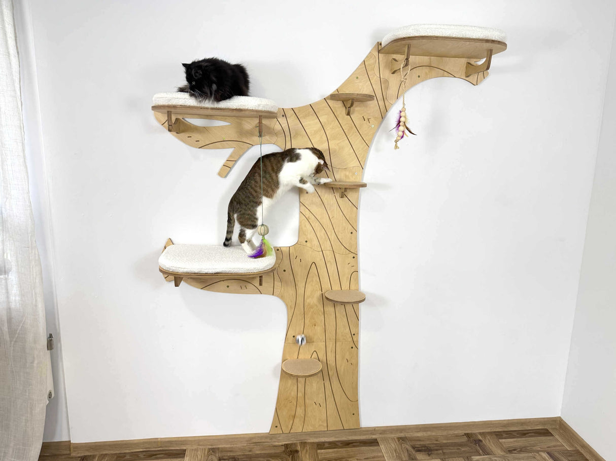 Wooden cat tree with two cats on a white background