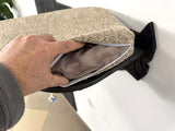 Person holding a textured cat seat cover