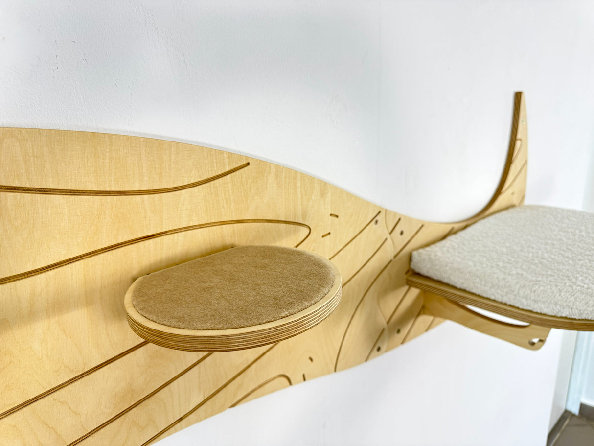 Wooden cat shelf with a textured surface and cushion on a white background
