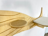 Wooden cat shelf with a textured surface and cushion on a white background