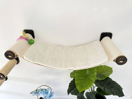 Cat hammock with round sisal steps and paw-shaped ends on a white background