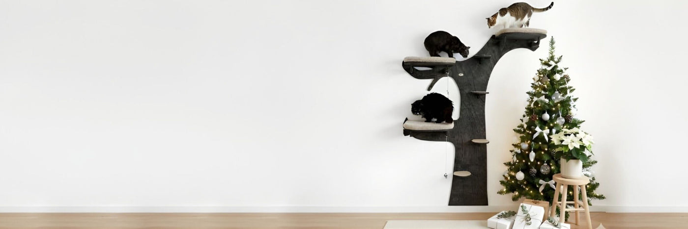 Cat tree with cats on a white wall background