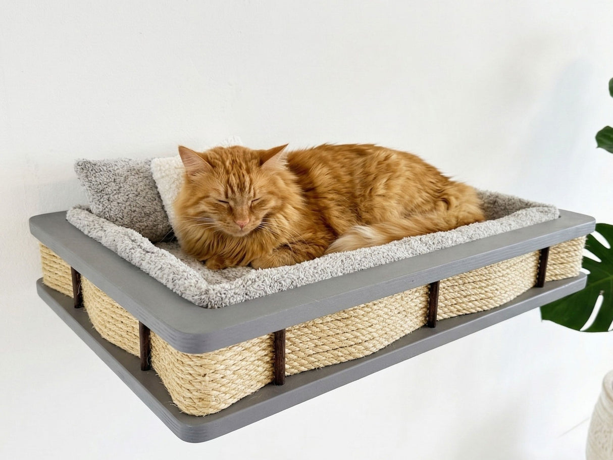 Cat lying on a elevated cat bed with sisal-wrapped sides and gray cushion.