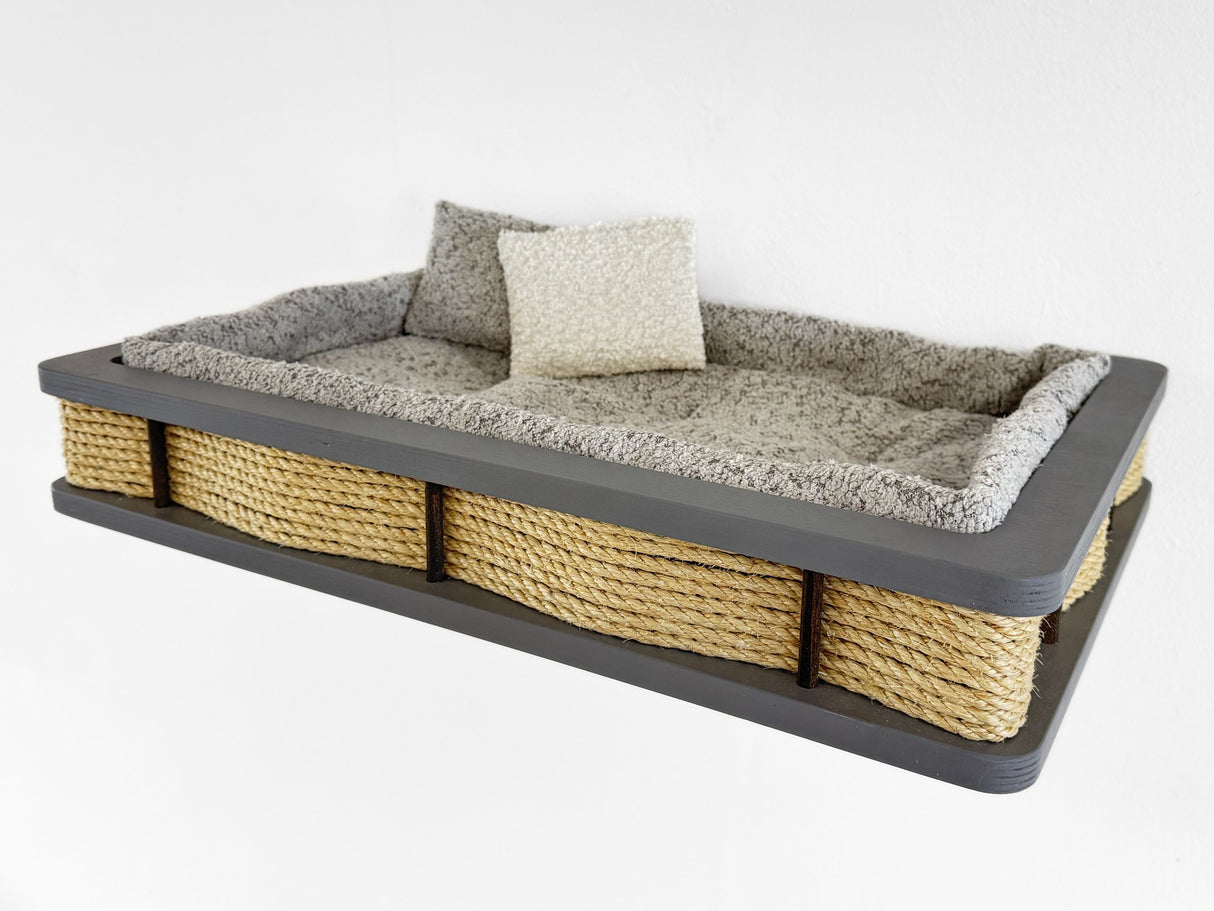 Pet bed with sisal-wrapped sides and plush cushion on a white background