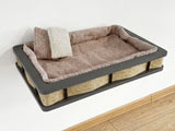 Pet bed with a gray frame and brown cushion on a white background