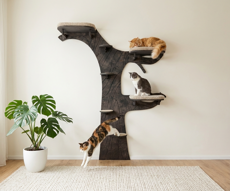 Cat tree with multiple levels and cats on a light-colored floor.
