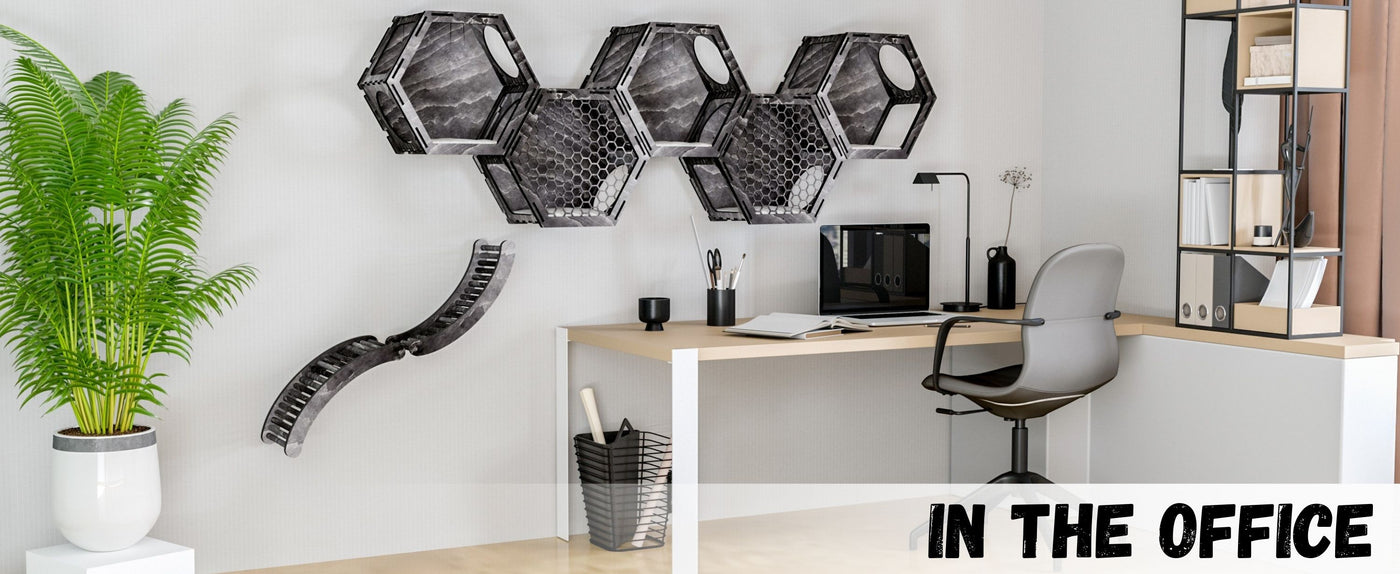 Modern office setup with cat hexagonal wall shelves, desk, and chair.
