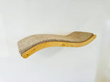 Curved wooden cat shelf with sisal-wrapped surface on a white background