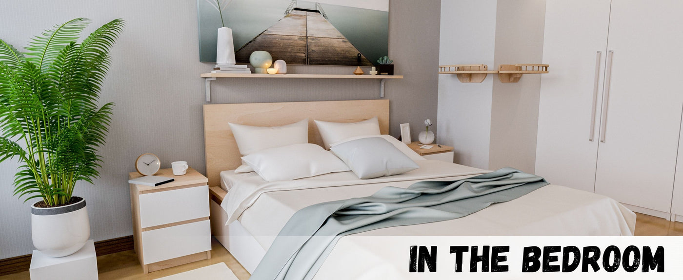 Modern bedroom with a bed, nightstands, and decor elements.