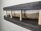 Detailed photo of the quality of the material from which the wall-mounted cat shelf is made